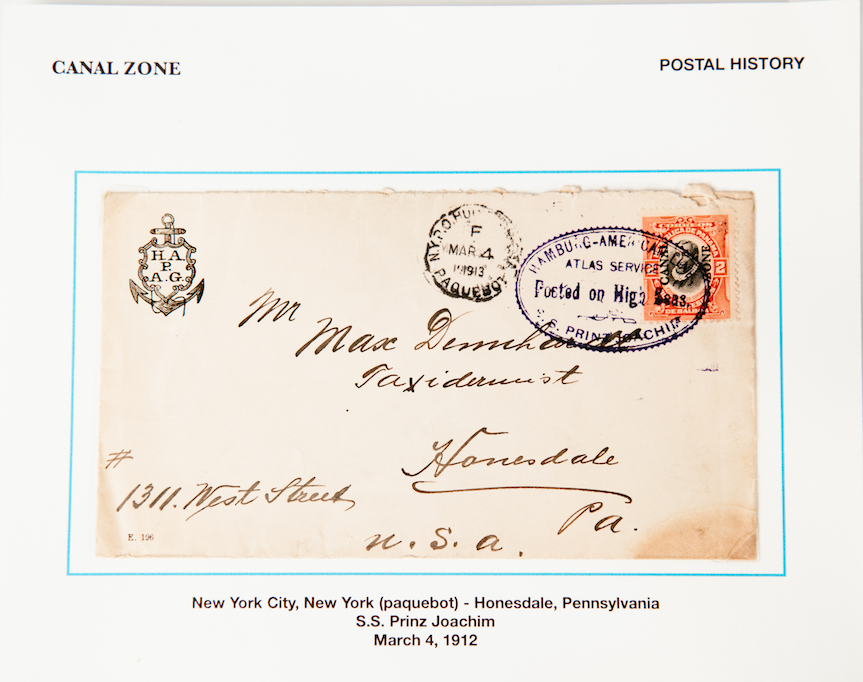 Mounted postal-history cover on a stamp album page with descriptive annotations.